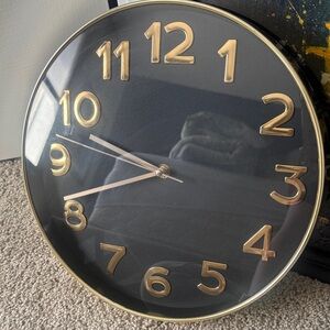 Elegant Black and Gold Wall Clock